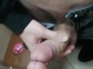 Guy fingering his big dick in the locker room close-up