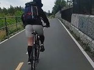 Hot ass woman biking in skin tights on public trail