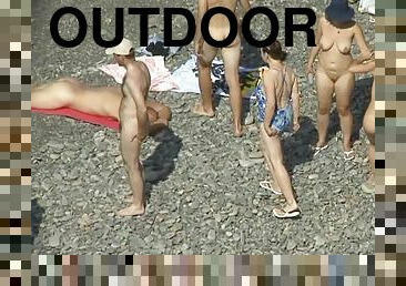 Sweet nudists are lying naked on the beach