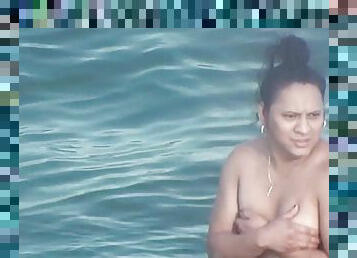 Chubby latina mom swims in the see without bra