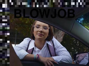 Kinky brunette gives lad a deep blowjob behind a wheel