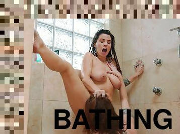 Two insatiable girlfriends make love in the shower