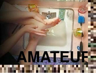 18 year old washing feet in sink