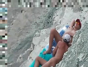 Husband eats out his wife on the beach