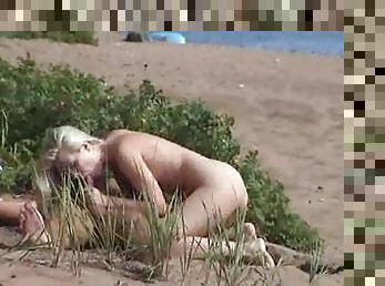 Voyeur couple has hot sex on the beach