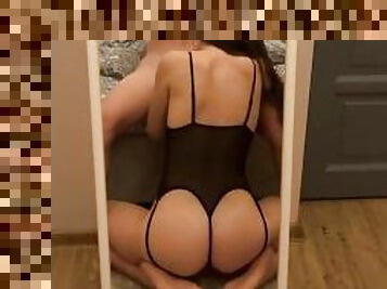 POV. Girlfriend in a sexy outfit gives a blowjob in front of mirror