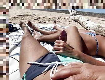 Blowjob on a nude beach