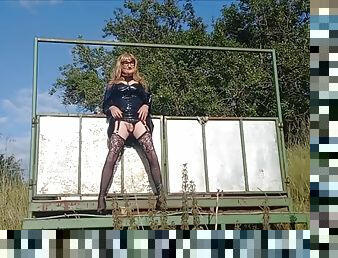 Crossdressing Gina pissing on the farm