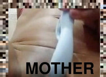 My stepmother gets up very wet and fucks her vibrator