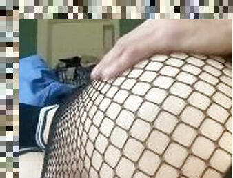 CD slut in fishnet skirt fucks her hole with big dildo