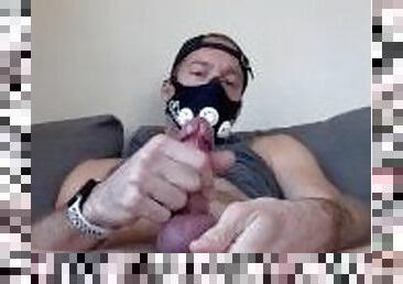 Masked stud wanks and cums on himself