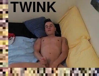 Horny twink Infamous J strokes his cock in bed