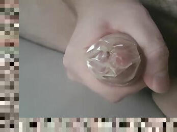 Condom inserted into urethra, pull condom out of urethra, cum