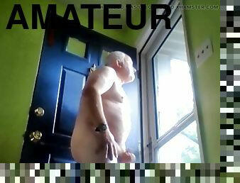 Masturbating at the door