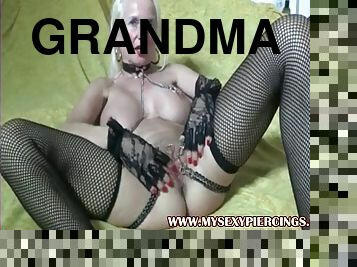My sexy pierced grandma with heavy piercings pussy stretching