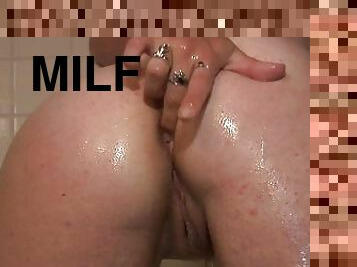 Chubby MILF Gets Filmed Fingering Her Pussy In The Shower