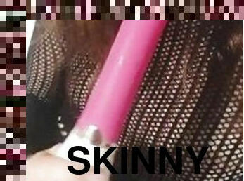 skinny girl gently sucks a vibrator