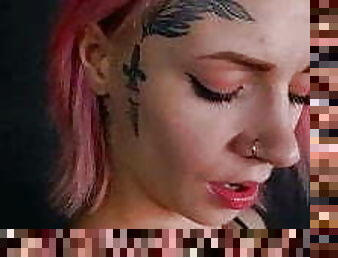 Girl with a tattoo on her face, playing with her pussy