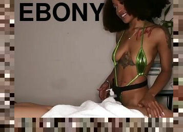 Tattooed ebony masseuse jerks off cock during erotic massage
