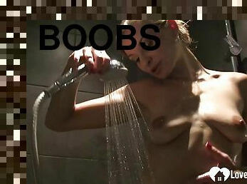 Cute babe with big boobs has a shower