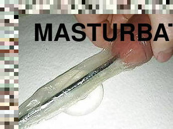 Urethral Sounding inside a condom, with cockring