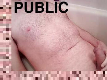 male peeing on chest in bathtub