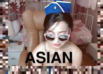 Asian beauty in uniform fucks her pussy