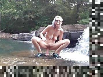 Getting naked outside and masturbating in a waterfall