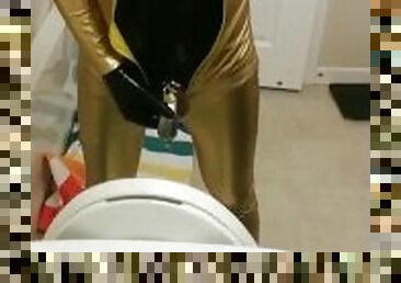 Peeing through chastity in catsuits