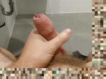 Stroking my dick in the mall public bathroom