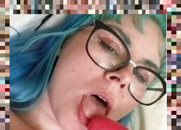 Blue haired teen tastes her own cum while sucking her toy