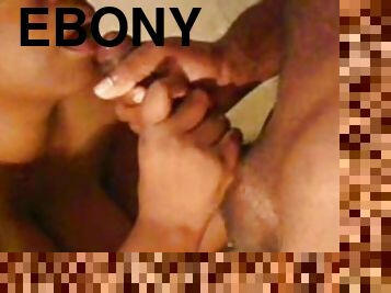 Sweet ebony is sucking this pretty hard dong