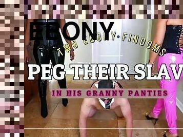 Two Ebony Findoms wearing Latex Humiliate & Peg their slave in his Granny Panties