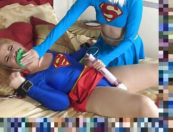 Pair of horny supergirls playing with vibrator in bed