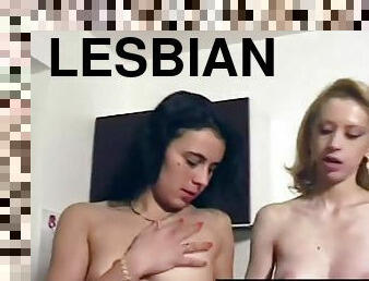 Two lesbians have fun with a strapon