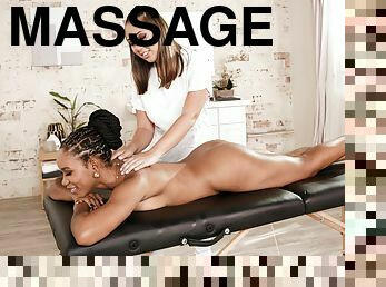 Jenna Sativa and Jenna Foxx licking passionately on the massage table