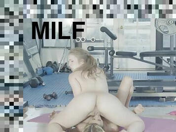 Lena Paul and MILF client Alexis Fawx have lesbian sex in the gym