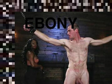 Ebony bodybuilder fucks male slave