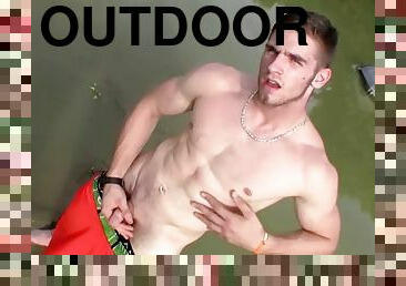 Athletic guy Elijah Knight jerks off and pisses solo outdoors