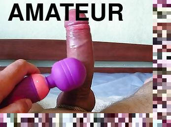 Horny guy jerks off a big cock with a vibro toy and cums with a big cumshot
