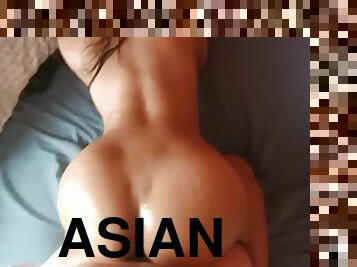 Big booty Asian girl oiled up