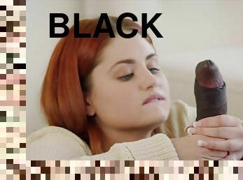 Ginger cutie lies down in bed with her dad’s black friend