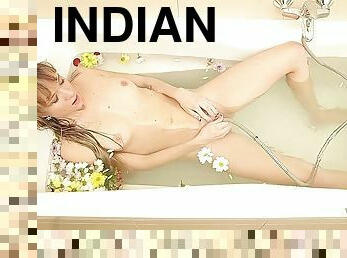 Naked sexy girl bathing in flowers