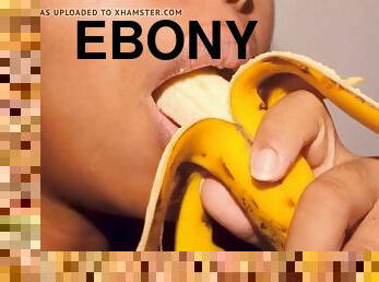 Naughty ebony with pouty lips playing with a banana