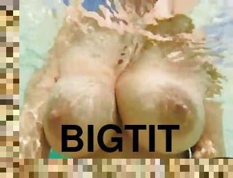 Big tits swimming