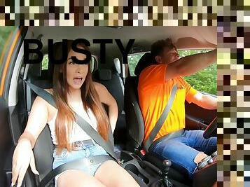 Busty student saddles a driving instructor in the backseat