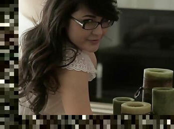 Girl with glasses shows off in sensual ways