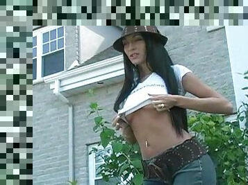 Black haired babe Lexxy shows off her natural tits outdoors