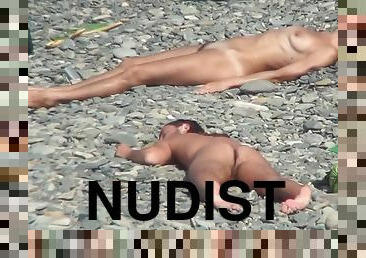 Sexy nudists are posing and lying naked