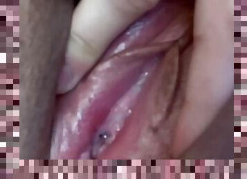 Solo female fingers her wet pussy